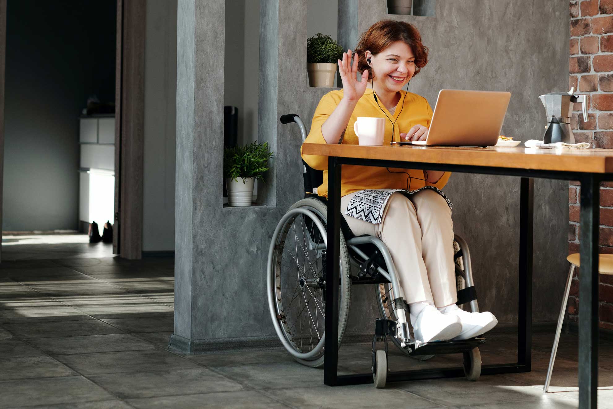 woman in orange tank top sitting on black wheelchair 4064696